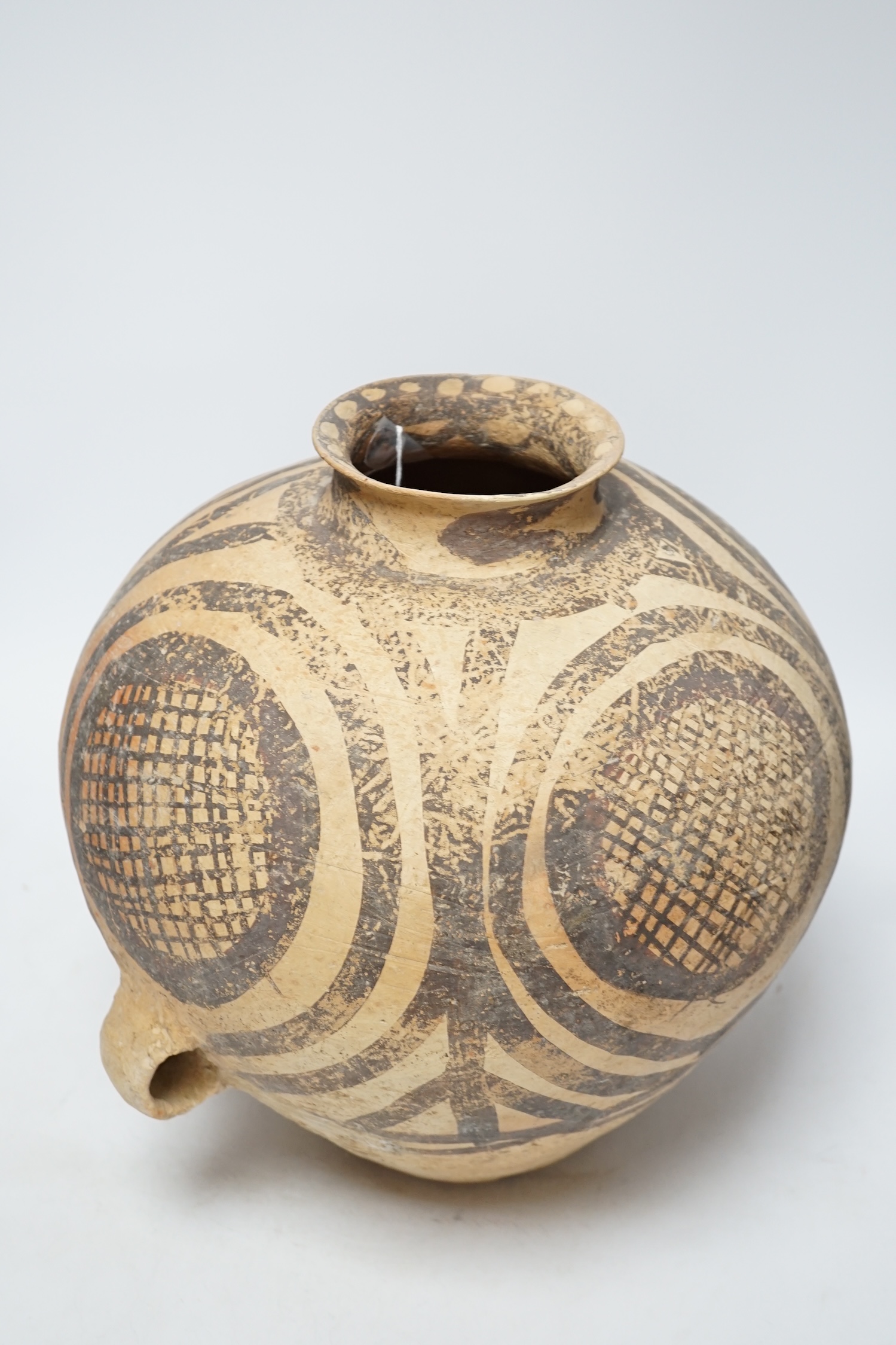 A large Chinese black painted pottery jar, Neolithic, Machang period, with Oxford Thermoluminescence certificate, 33cm